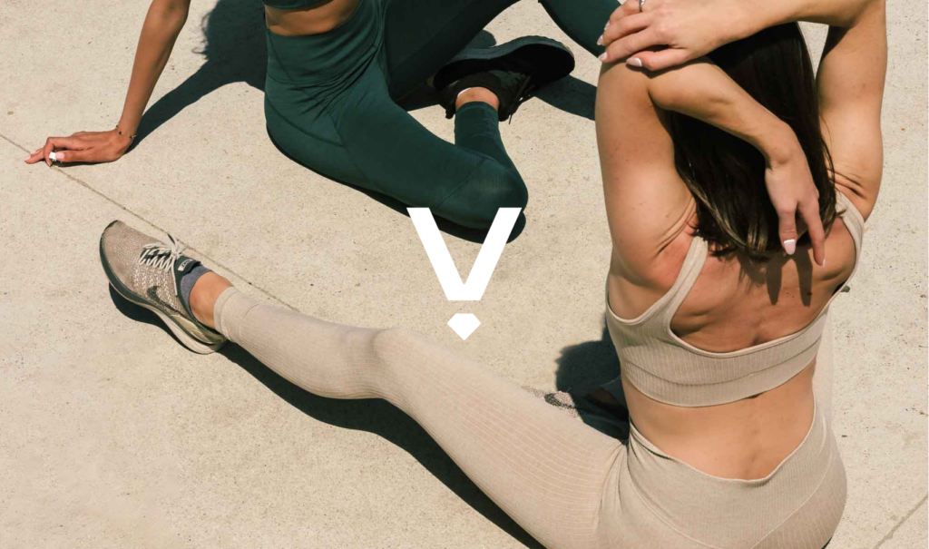 Verdandi logo over image of two women in active wear stretching